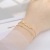 Factory direct sales of simple cut titanium steel Mama text pendants from Europe and America, Mother's Day stainless steel double-layer chain bracelets, versatile for women details Picture